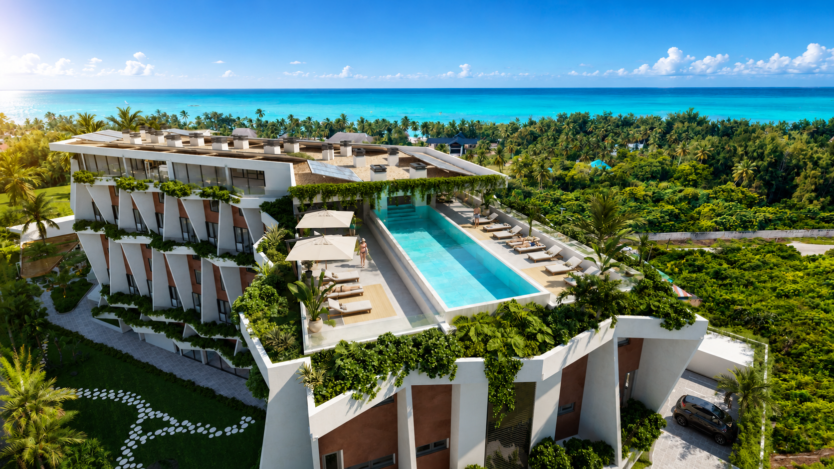 Adults-only rooftop infinity pool looking out over the Indian Ocean at golden hour